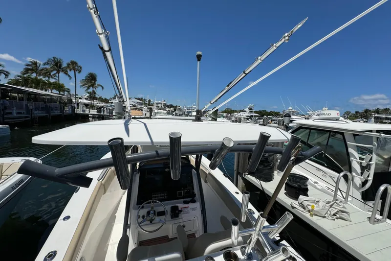 Slide: The Image of 2017 Sea Fox 288 Commander boat docked at marina under clear blue sky. - 32