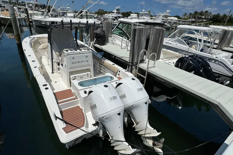 Slide: The Image of 2017 Sea Fox 288 Commander boat docked with twin Yamaha 300 engines. - 33