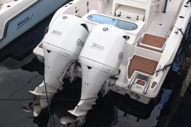 Slide: The Image of 2017 Sea Fox 288 Commander with twin 300 horsepower engines docked in water. - 34