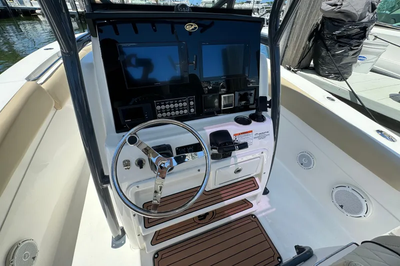 Slide: The Image of 2017 Sea Fox 288 Commander boat cockpit with steering wheel and control panel. - 7