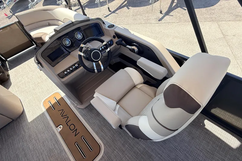 Slide: The Image of 2026 Avalon 2385 LSZ Tri Toon boat interior with modern helm and seating. - 22