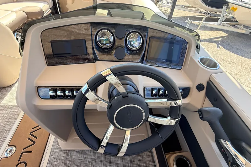 Slide: The Image of Steering console of 2026 Avalon 2385 LSZ Rear Fish Tri Toon boat, featuring modern controls. - 24