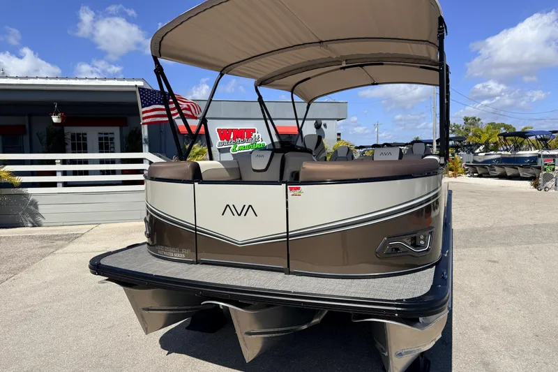 Slide: The Image of 2026 Avalon 2385 LSZ Rear Fish Tri Toon boat displayed outdoors under a clear sky. - 3