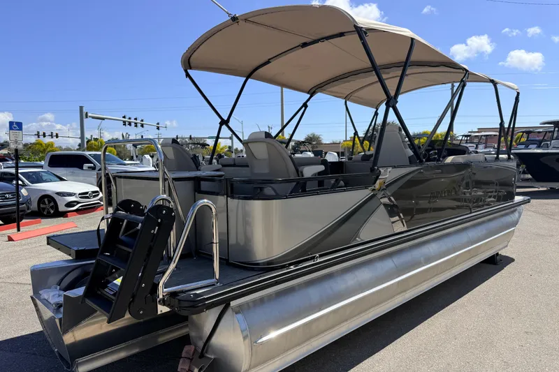 Slide: The Image of 2026 Avalon 2385 LSZ Rear Fish Tri Toon boat with canopy in parking lot. - 7
