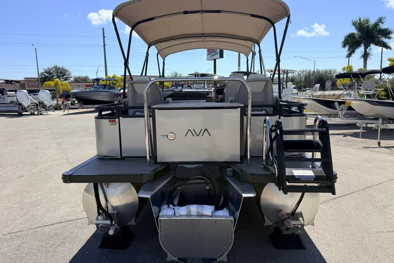 Slide: The Image of 2026 Avalon 2385 LSZ Rear Fish Tri Toon boat, high performance, parked outdoors. - 8