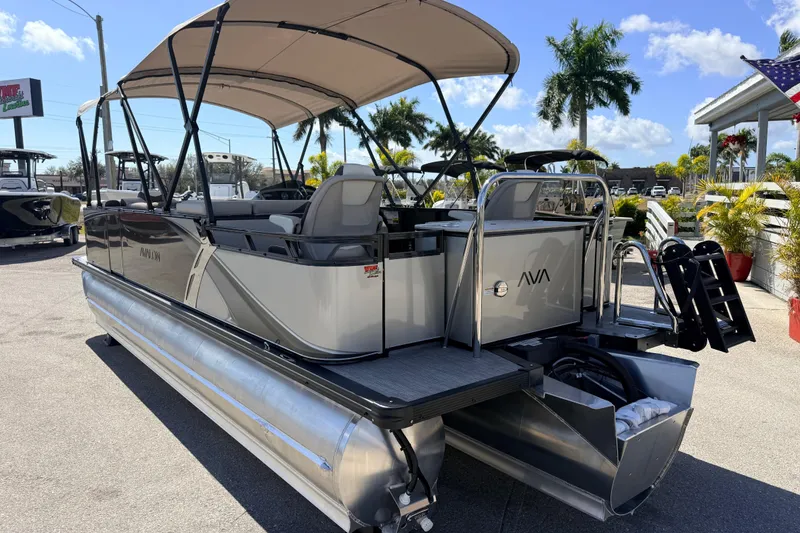 Slide: The Image of 2026 Avalon 2385 LSZ Rear Fish Tri Toon boat with canopy, parked outdoors. - 9