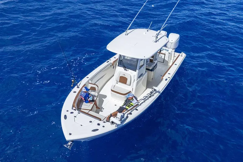 Slide: The Image of Manufacturer Provided Image: 2025 Cobia 285 Center Console boat on open blue ocean. - 5