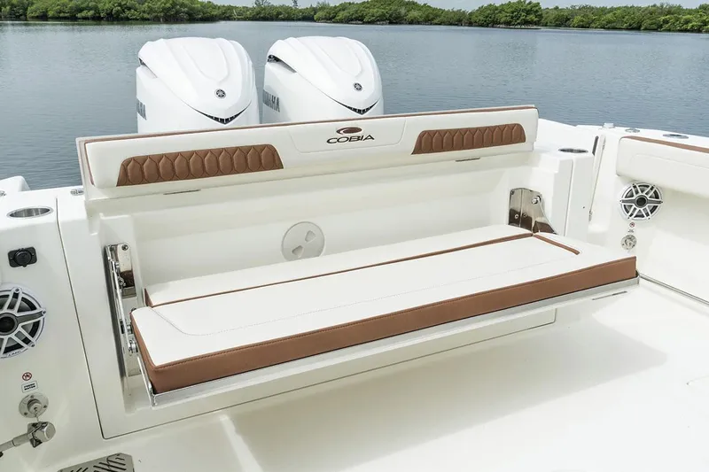 Slide: The Image of Manufacturer Provided Image: 2025 Cobia 285 Center Console boat with dual engines and cushioned seating. - 8