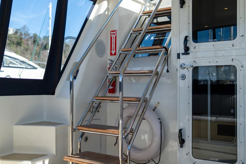 Slide: The Image of Stainless steel and wood stairs on 2013 Coastal Craft 45 yacht interior. - 10