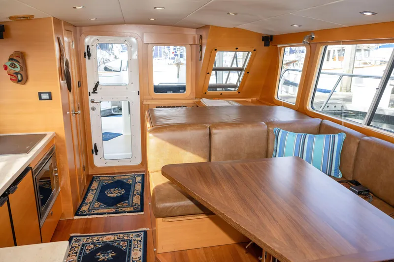 Slide: The Image of Luxurious interior of 2013 Coastal Craft 45 yacht with wood finishes and comfortable seating. - 24