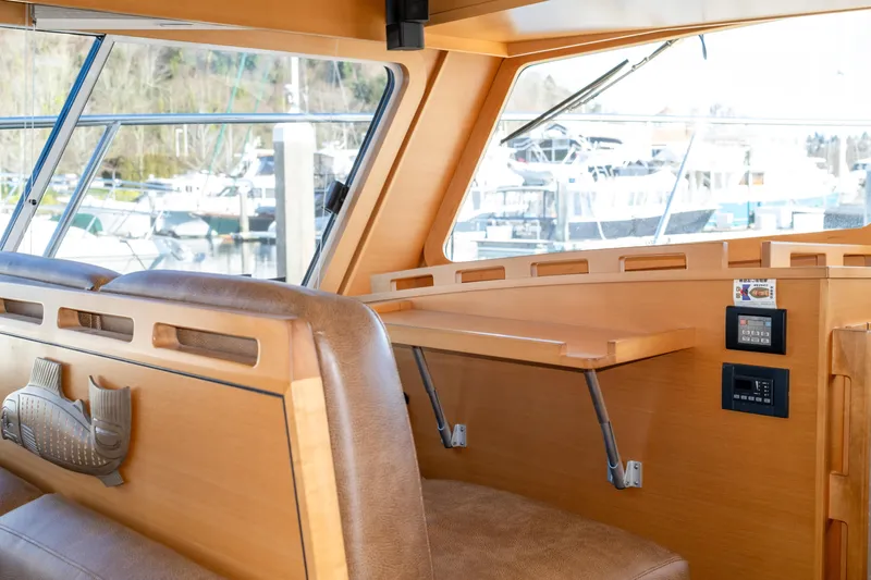 Slide: The Image of Interior of 2013 Coastal Craft 45 yacht with wooden finish and leather seating. - 29