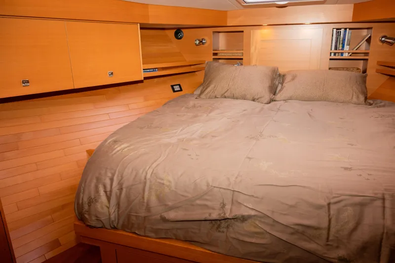Slide: The Image of Cozy bedroom interior of 2013 Coastal Craft 45 yacht with wooden paneling and plush bedding. - 33