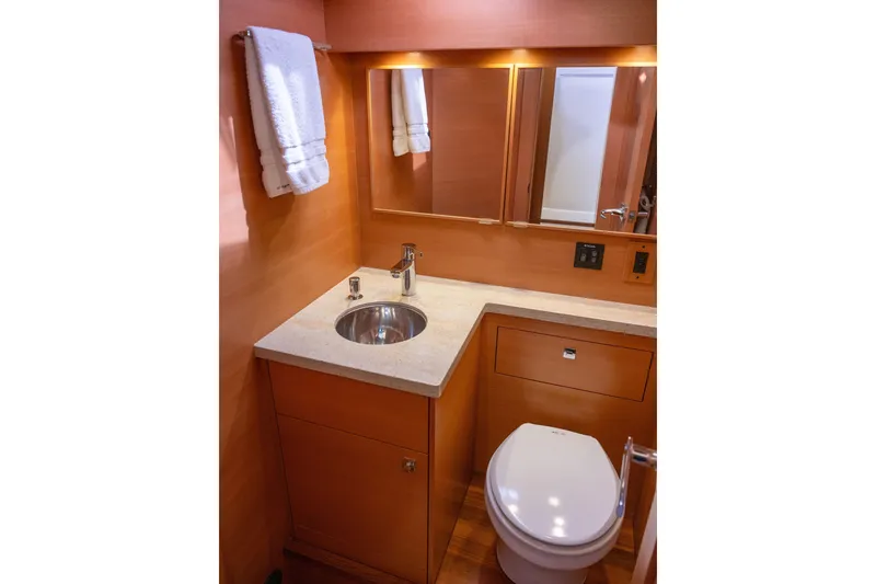 Slide: The Image of Luxurious bathroom in 2013 Coastal Craft 45 yacht with modern fixtures and wooden cabinetry. - 34