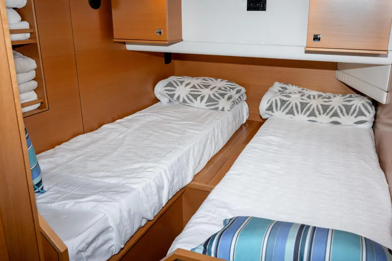 Slide: The Image of Interior of 2013 Coastal Craft 45 yacht with twin beds and wooden cabinetry. - 36