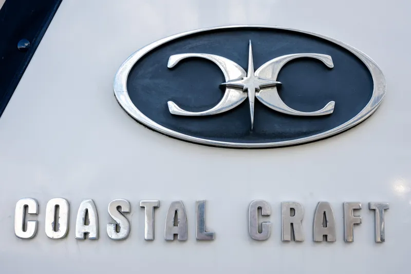 Slide: The Image of Coastal Craft 45 emblem, 2013 model, featuring distinctive logo and lettering. - 42