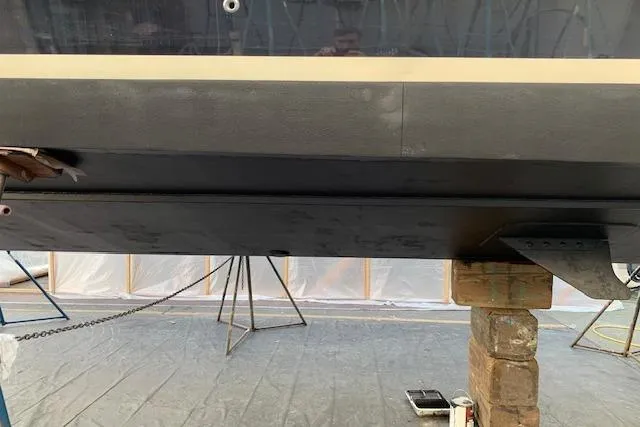 Slide: The Image of 2013 Coastal Craft 45 yacht hull on stands in a workshop setting. - 46