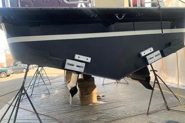 Slide: The Image of 2013 Coastal Craft 45 boat hull on stands in a workshop. - 47