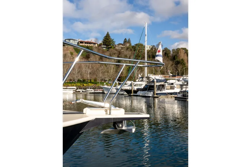 Slide: The Image of 2013 Coastal Craft 45 yacht docked in scenic marina with clear skies. - 7