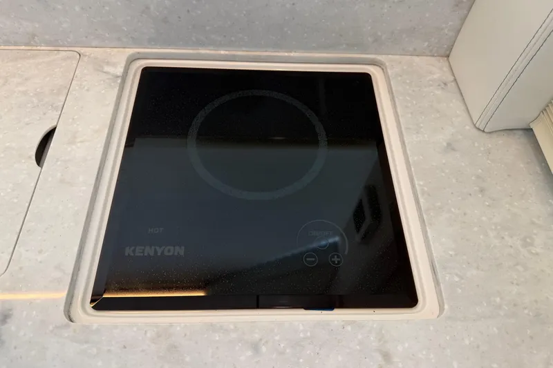 Slide: The Image of Kenyon electric cooktop on 2021 Regal 36 XO yacht's countertop. - 20