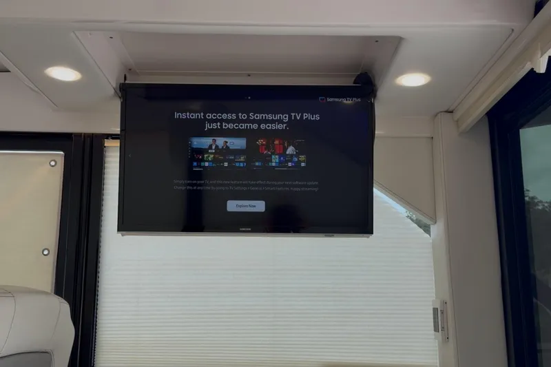 Slide: The Image of Flat-screen TV displaying Samsung TV Plus in a 2021 Regal 36 XO yacht interior. - 23