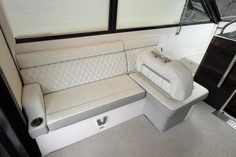 Slide: The Image of Luxurious interior seating of 2021 Regal 36 XO boat with diamond-stitched upholstery. - 25