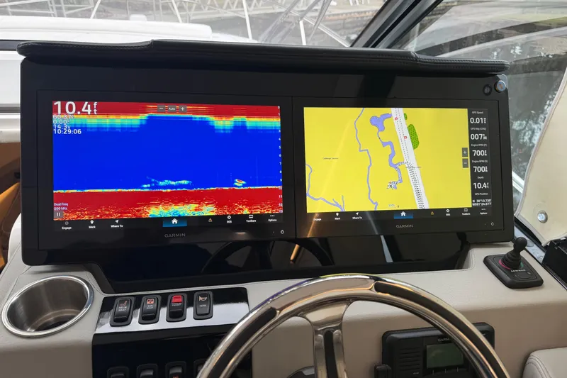 Slide: The Image of Dashboard of 2021 Regal 36 XO with Garmin navigation and sonar displays. - 29