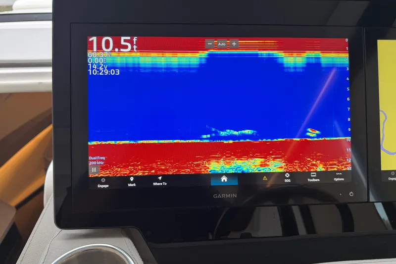 Slide: The Image of Garmin sonar display on 2021 Regal 36 XO boat, showing depth and underwater details. - 31