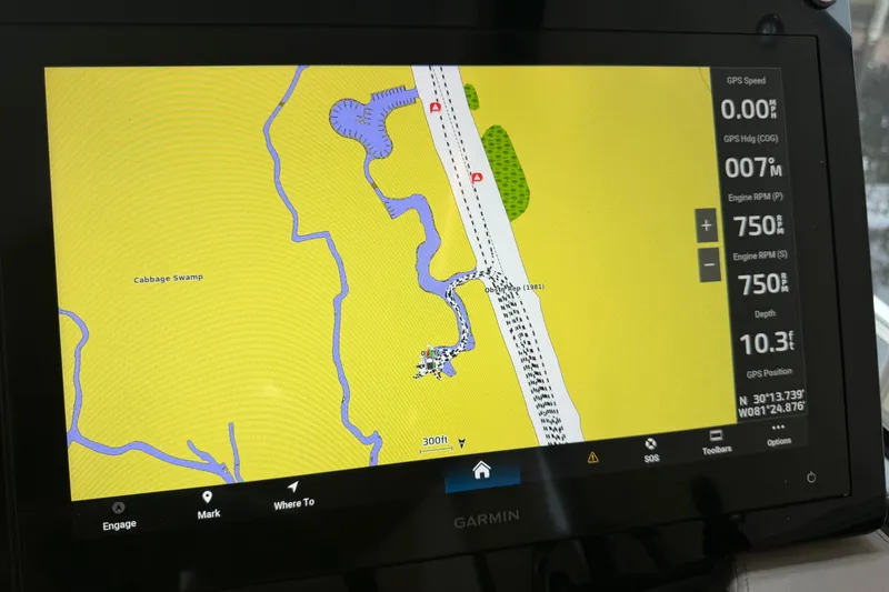 Slide: The Image of Garmin navigation display on 2021 Regal 36 XO boat, showing map and engine data. - 32