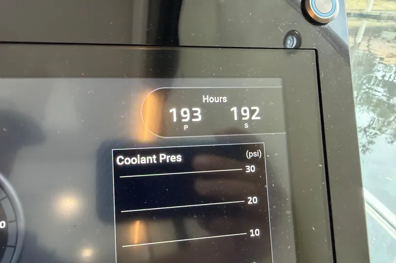 Slide: The Image of Display screen of a 2021 Regal 36 XO showing engine hours and coolant pressure. - 33