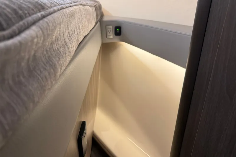 Slide: The Image of Interior of 2021 Regal 36 XO boat with modern lighting and power outlet. - 42