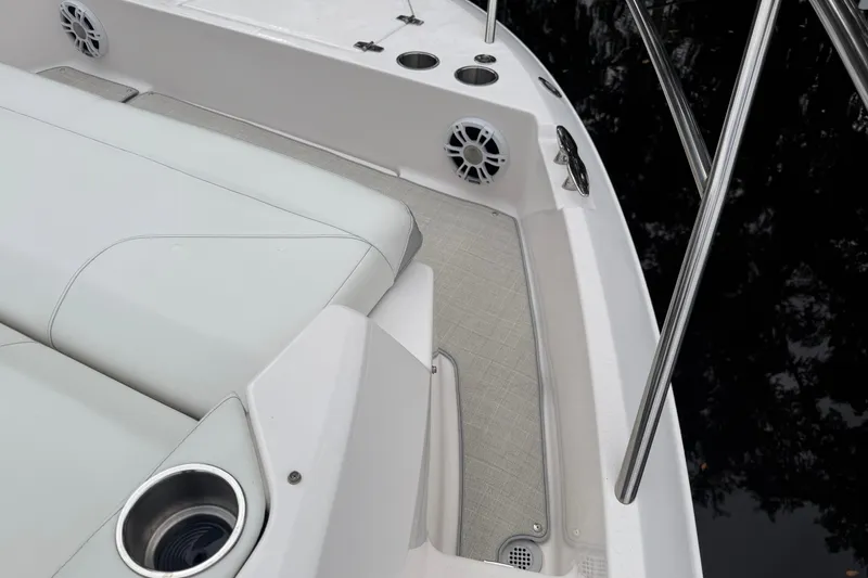 Slide: The Image of 2021 Regal 36 XO boat interior with cushioned seating and stainless steel railings. - 60