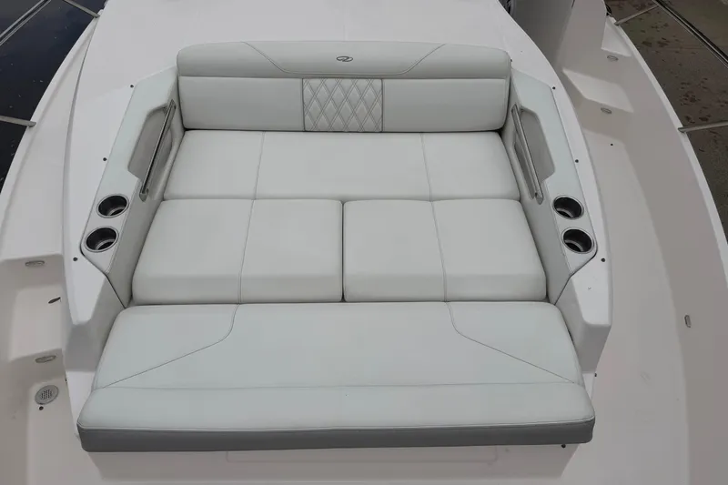 Slide: The Image of Luxurious seating on 2021 Regal 36 XO boat with cup holders and elegant design. - 61