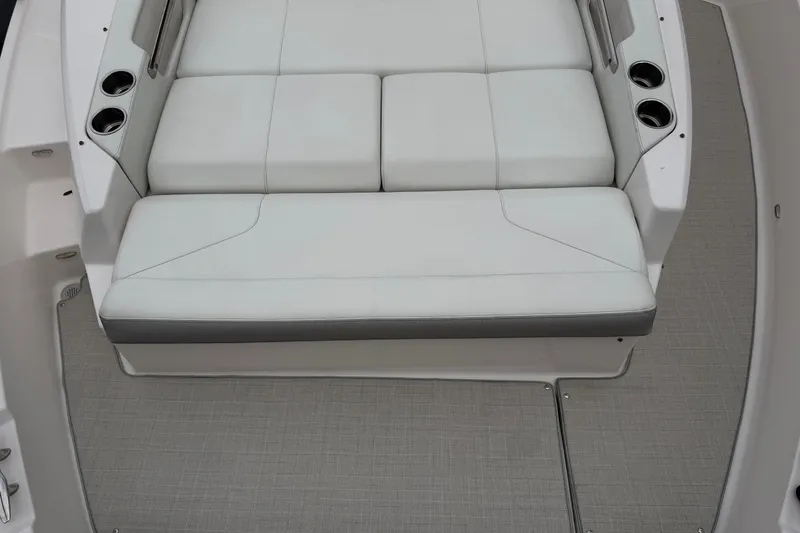 Slide: The Image of Luxurious seating area on 2021 Regal 36 XO boat with cup holders. - 62