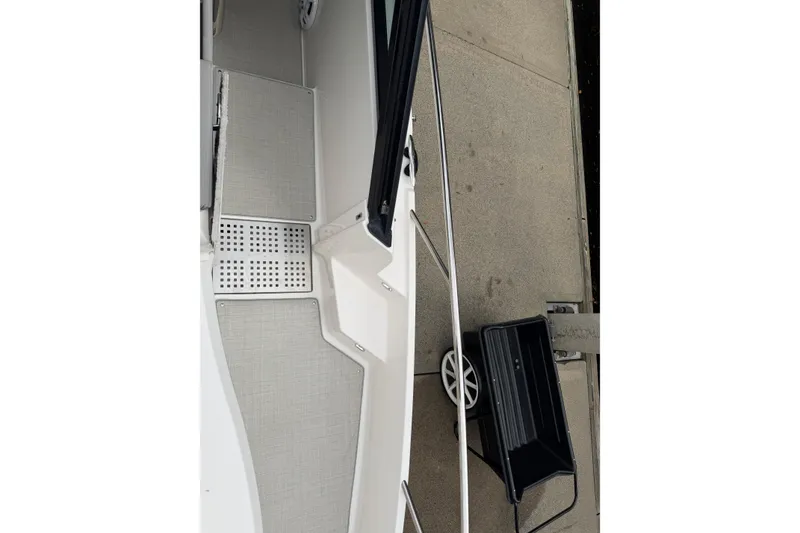 Slide: The Image of 2021 Regal 36 XO boat deck with dockside view and cart. - 63