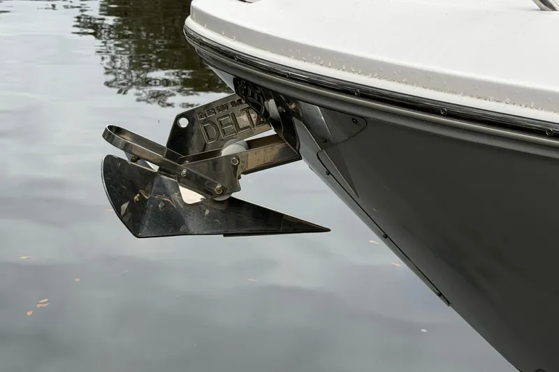 Slide: The Image of Bow anchor of 2021 Regal 36 XO boat on calm water. - 64