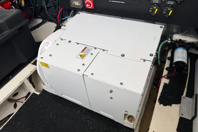 Slide: The Image of Engine compartment of 2021 Regal 36 XO boat with electrical components and wiring. - 67