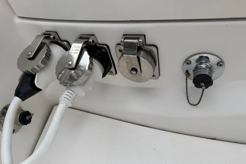 Slide: The Image of Control panel of a 2021 Regal 36 XO boat with various switches and gauges. - 78