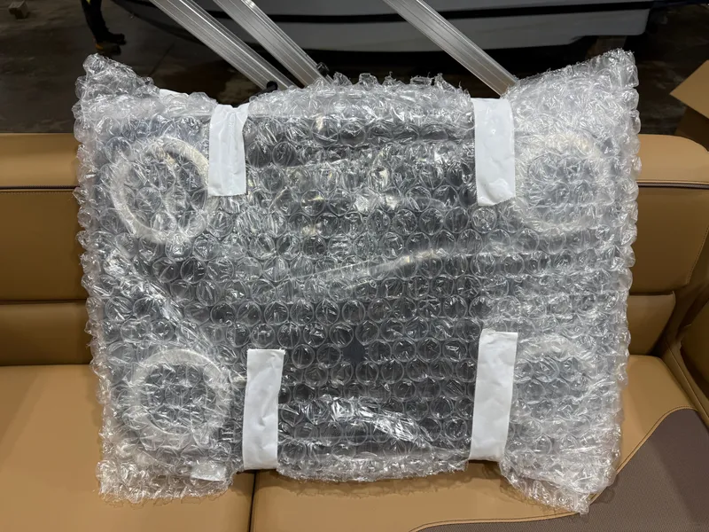 Slide: The Image of Packaged part of Tahoe Sport 23E80 pontoon, 2026 model. - 25