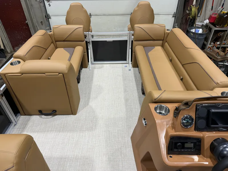 Slide: The Image of Interior of 2026 Tahoe Sport 23E80 Pontoon with beige leather seating. - 29