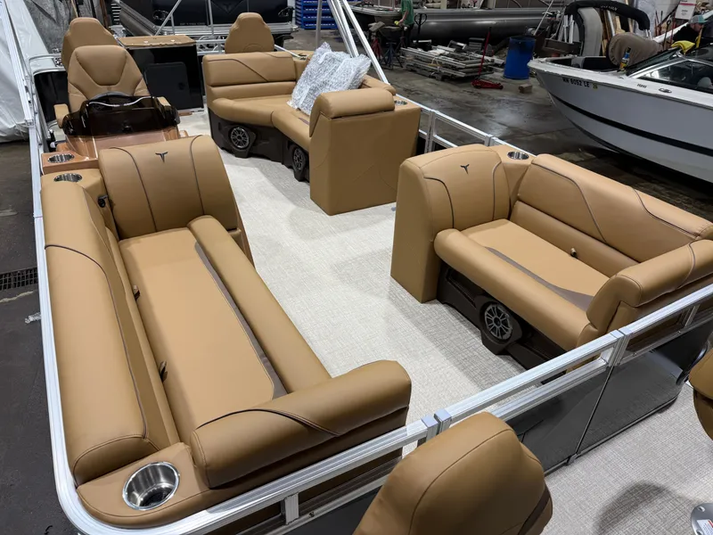 Slide: The Image of Interior of 2026 Tahoe Sport Pontoon with beige leather seating. - 32