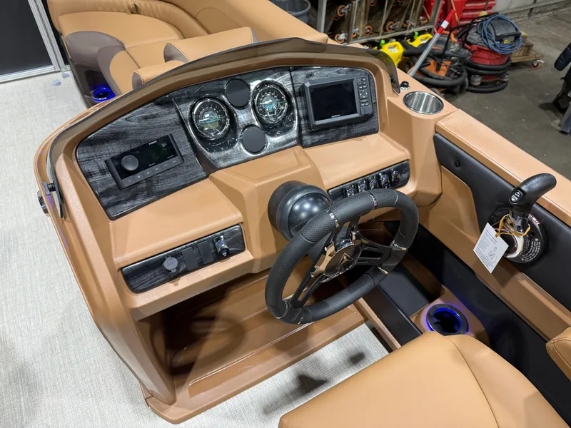 Slide: The Image of Interior of 2026 Tahoe LTZ 2385 Elite Cruise Tritoon. - 11