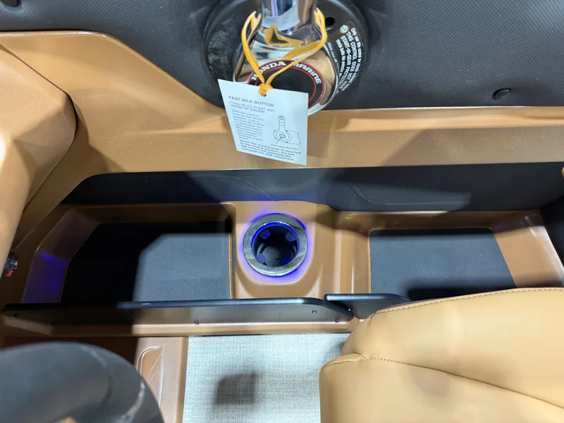 Slide: The Image of Interior of 2026 Tahoe LTZ 2385 Elite Cruise Tritoon with illuminated cup holder. - 15