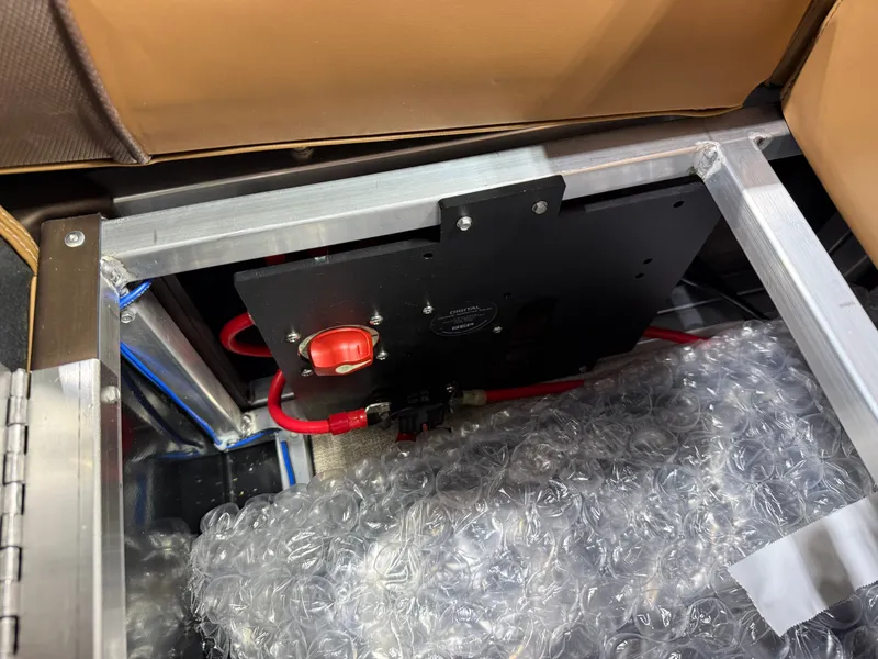 Slide: The Image of Interior view of Tahoe LTZ 2385 Elite Cruise Tritoon, 2026 model. - 21