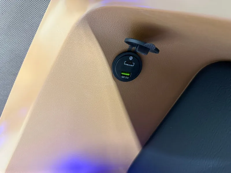 Slide: The Image of USB charging port in 2026 Tahoe LTZ 2385 Elite Cruise Tritoon. - 30