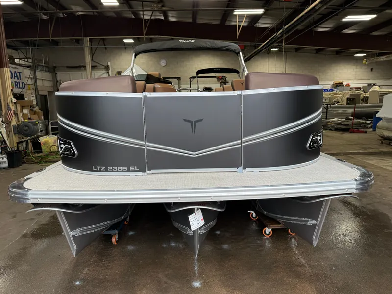 Slide: The Image of 2026 Tahoe LTZ 2385 Elite Cruise Tritoon in a workshop. - 33