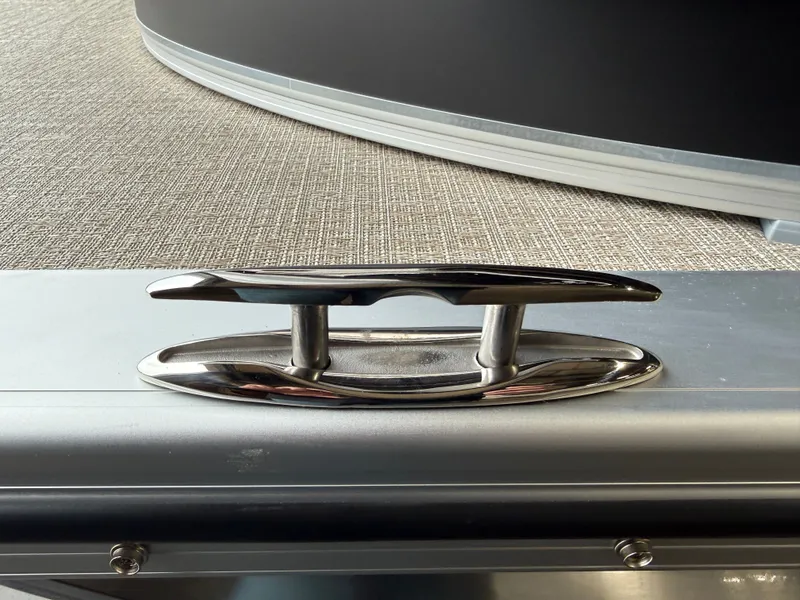 Slide: The Image of Close-up of a boat cleat on a 2026 Tahoe LTZ 2385 Elite Cruise Tritoon. - 35