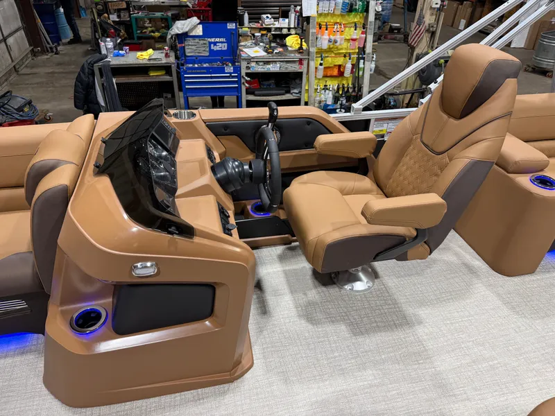 Slide: The Image of Luxurious helm of 2026 Tahoe LTZ 2385 Elite Cruise Tritoon. - 9