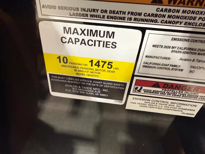 Slide: The Image of Boat label showing capacity and safety warnings, 2026 Tahoe Sport model. - 15