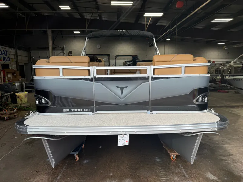 Slide: The Image of 2026 Tahoe Sport 1980 Cruise pontoon boat in a workshop. - 32