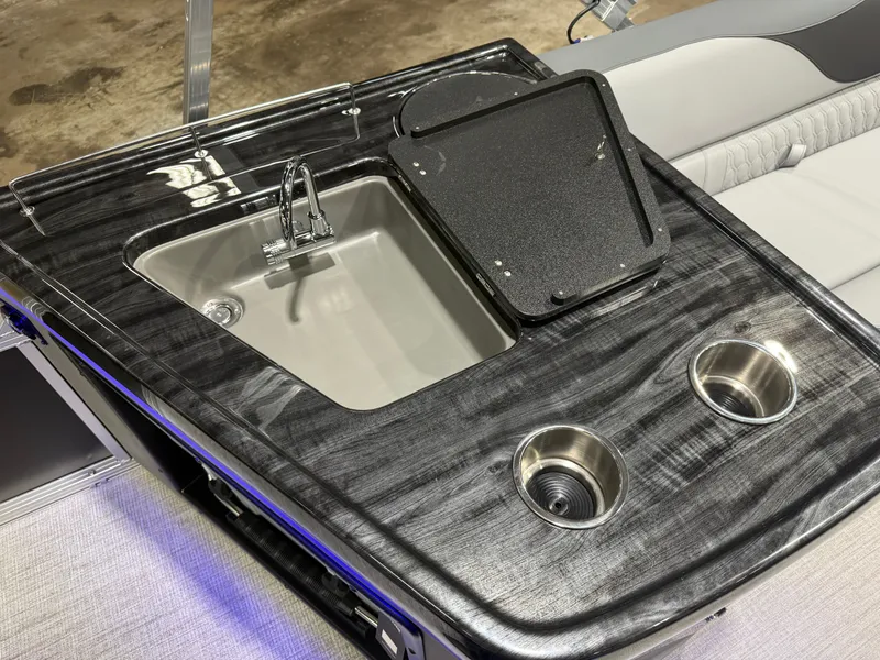 Slide: The Image of Luxury onboard kitchenette on the Tahoe LTZ 2385 Elite Tritoon. - 22